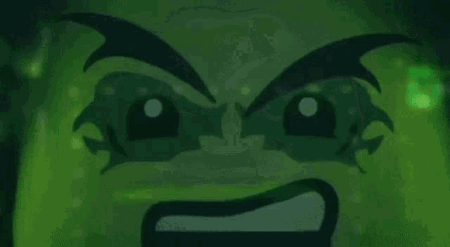 a close up of a lego figure with a green face and a smile .