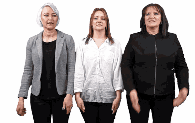 three women are standing next to each other and one is wearing a white shirt