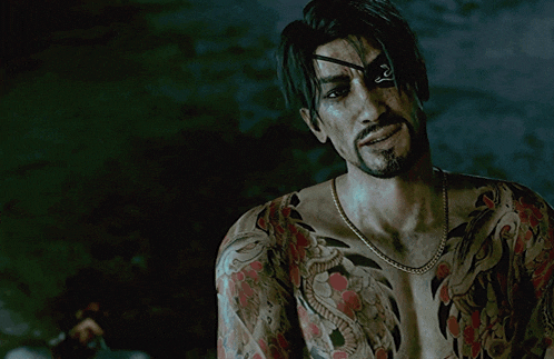 a man with a tattoo on his chest has an eye patch