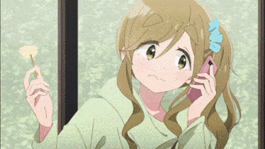 a girl talking on a cell phone while holding a key