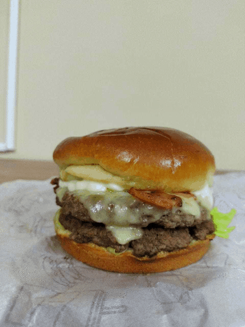a close up of a hamburger on a bun