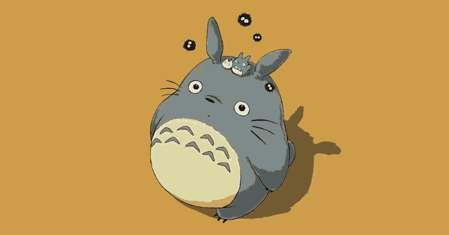 a cartoon drawing of a totoro with a smaller totoro on top of it