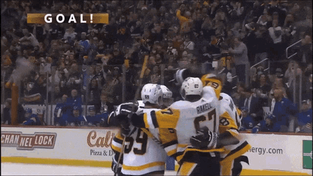 a hockey game is being played in front of a sign that says cal 's pizza and drinks