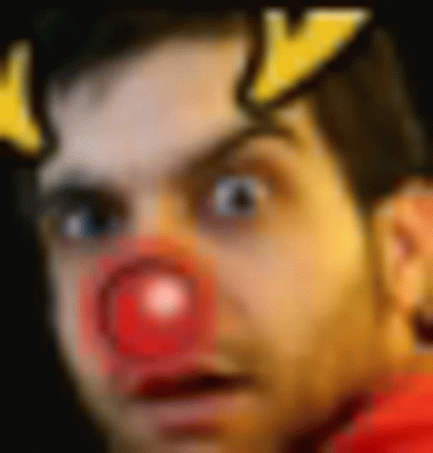 a blurry picture of a man with a red nose