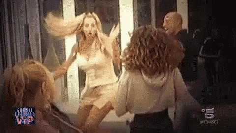 a group of women are dancing in a room with the number 5 on the bottom