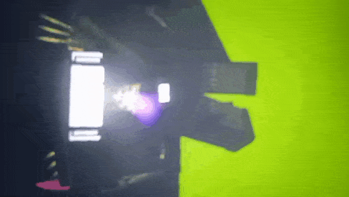 a green background with a purple light coming out of the corner
