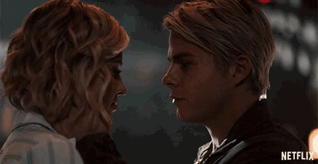 a man and a woman are looking into each other 's eyes with a netflix logo in the corner