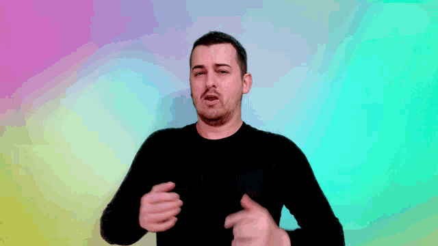 a man in a black shirt is making a funny face