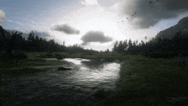 a river flows through a grassy field with trees in the background