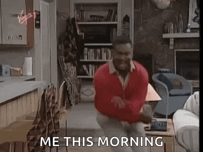 a man in a red sweater is jumping in the air in a living room with the words `` me this morning '' .