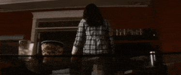 a close up of a person standing in a sink with a hose coming out of the sink .