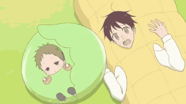 two anime characters are laying on a blanket on the ground .