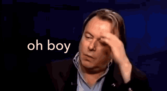 a man in a suit is scratching his head with his hand and the words oh boy are behind him .
