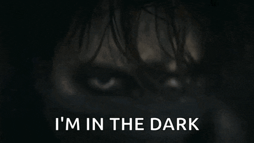 a close up of a person 's face with the words " i 'm in the dark " above it