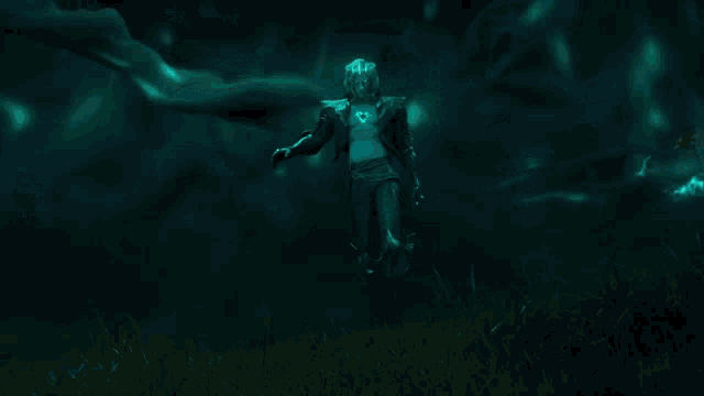 a person is holding a glowing sword in a dark room