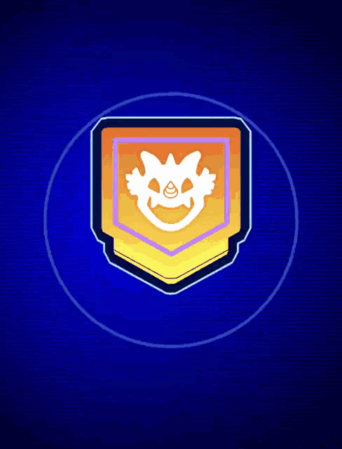 a badge with a monster face on it