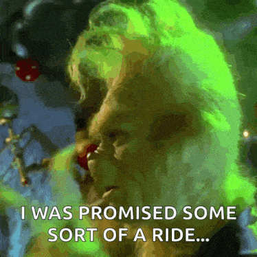 a man with green hair says " i was promised some sort of a ride ... "