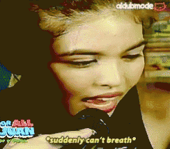 a woman talking into a microphone with the words " suddenly can 't breath " visible