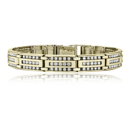 a yellow gold bracelet with diamonds and the word cartier on it