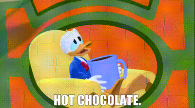 donald duck is sitting in a chair holding a cup of hot chocolate