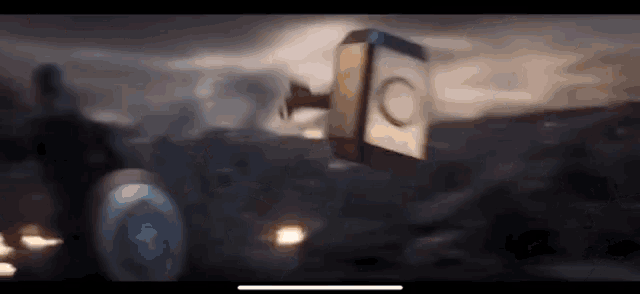 thor 's hammer is flying through the air in a blurry scene