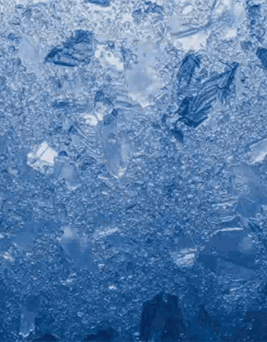 a close up of ice cubes on a blue background