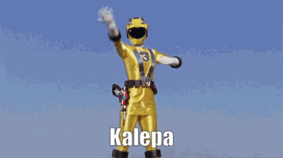 a yellow power ranger with the number 3 on the chest