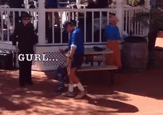 a man in a blue shirt is standing in front of a gazebo with the word gurl written on the side