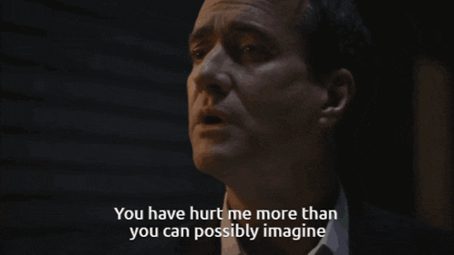 a man in a suit and tie says you have hurt me more than you can possibly imagine