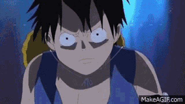 monkey d luffy from one piece is looking at the camera with a very angry face .