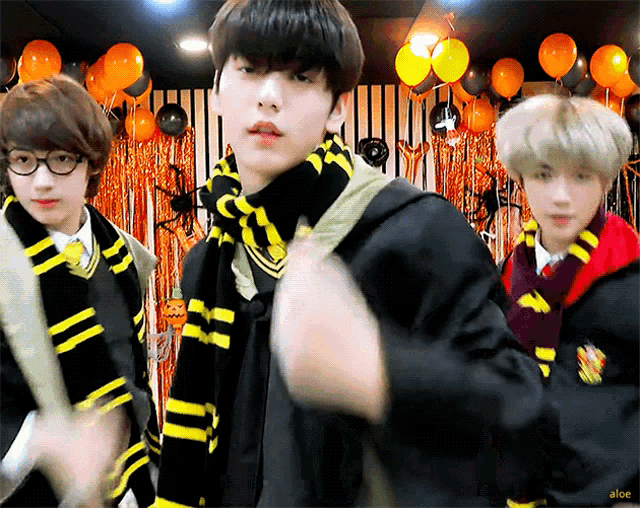 a group of young men dressed in harry potter costumes are posing for a picture