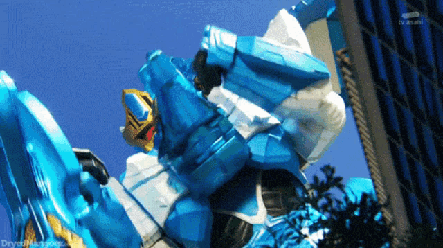 a blue and white robot with tv asahi written on the bottom