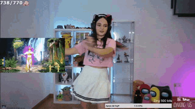 a girl is dancing in front of a screen that says 738/770 on it