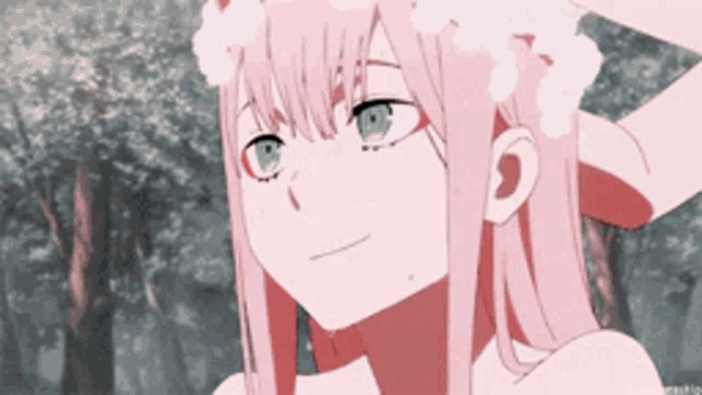 a girl with pink hair and blue eyes is taking a shower