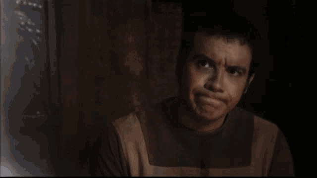 a man in a dark room with the word rien written on the bottom