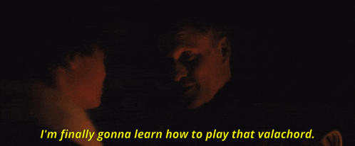 a man talking to a woman with the words " i 'm finally gonna learn how to play that valachord " above him