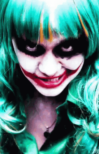 a woman in a joker costume is smiling