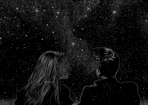 a man and a woman are looking up at the stars