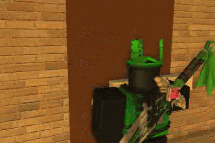 a video game character is standing in front of a brick wall holding a green sword .