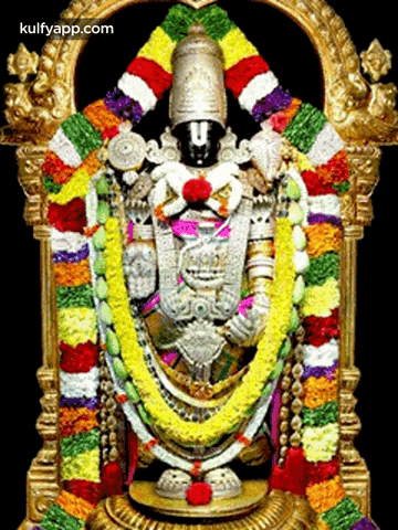 a statue of a deity is surrounded by flowers and has the website kulfvapp.com at the bottom of the image