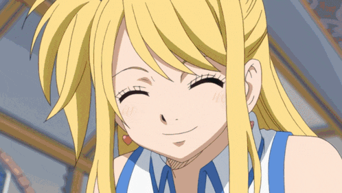 a girl with blonde hair and a blue and white shirt is smiling with her eyes closed