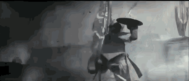 a man is holding a shield and a sword in his hand .