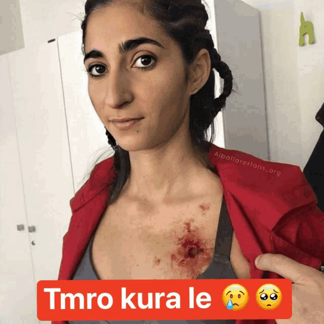 a woman 's chest is shown with the words tmro kura le above it