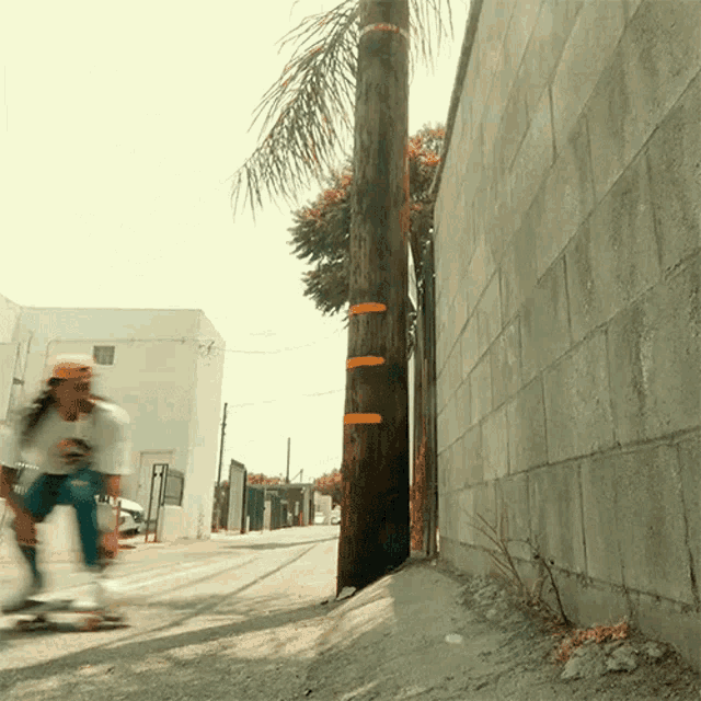 a person is riding a skateboard down a street