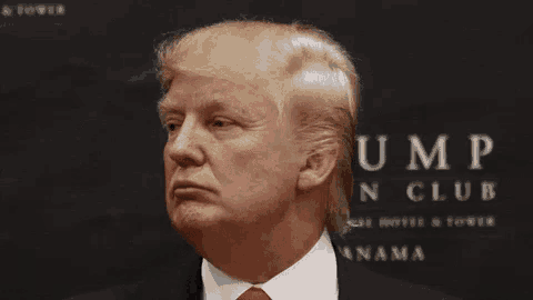 donald trump is making a funny face in front of a sign for the trump n club