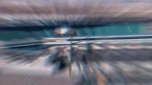 a blurry picture of a person riding a bike