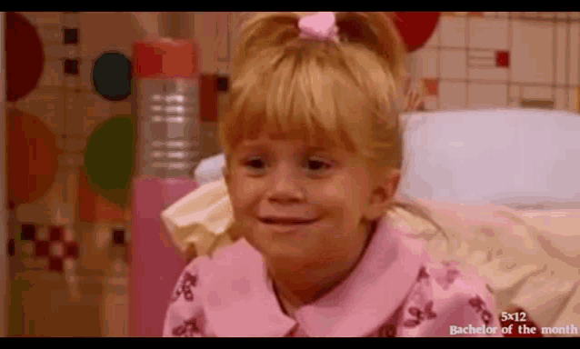 a girl in a pink shirt is smiling in a bachelor of the month ad