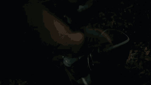 a person is laying on the ground with a helmet on