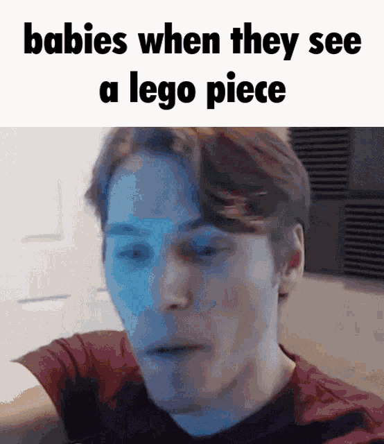 a man in a red shirt with the words babies when they see a lego piece above him