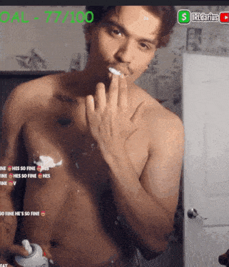 a shirtless man is shaving his face with a shaving cream bottle in front of him